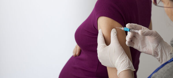 Pregnant woman receiving a vaccine